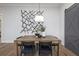 Stylish dining room with modern light fixture and decorative barn door at 327 Brooke View Trail, Canton, GA 30115
