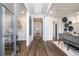 Bright entryway with hardwood floors flowing into an open dining room space at 327 Brooke View Trail, Canton, GA 30115