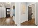 Bright entryway featuring hardwood floors, white trim, and a glimpse of the front door at 327 Brooke View Trail, Canton, GA 30115