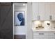 Modern kitchen details include white cabinets, quartz countertops, and a stylish sliding barn door at 327 Brooke View Trail, Canton, GA 30115
