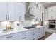 Modern kitchen showcasing white cabinets, stainless steel appliances, and marble backsplash at 327 Brooke View Trail, Canton, GA 30115
