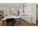 Contemporary kitchen with white cabinetry, stainless steel appliances, and a large island at 327 Brooke View Trail, Canton, GA 30115