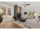 Cozy living room featuring a fireplace, large windows, and comfortable seating at 327 Brooke View Trail, Canton, GA 30115