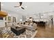 Open-concept living room featuring hardwood floors and a kitchen island with bar seating at 327 Brooke View Trail, Canton, GA 30115