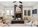 Beautiful living room with a fireplace, large windows, and comfortable seating at 327 Brooke View Trail, Canton, GA 30115