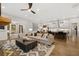 Bright and airy living room flowing into the kitchen featuring modern furnishings and lots of natural light at 327 Brooke View Trail, Canton, GA 30115
