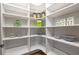 Walk-in pantry with open shelving, offering lots of space to organize all your storage needs at 327 Brooke View Trail, Canton, GA 30115