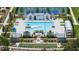 Aerial view of a resort-style pool area featuring cabanas, lounge chairs, and manicured landscaping at 327 Brooke View Trail, Canton, GA 30115
