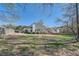 Expansive backyard with mature trees, a privacy fence, and plenty of room for outdoor activities at 3619 Elinburg Ne Ct, Buford, GA 30519