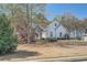 Front lawn view of the home with stone accents and a well-manicured garden at 3619 Elinburg Ne Ct, Buford, GA 30519