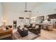 Bright open-concept living room with vaulted ceilings, hardwood floors, and ample natural light at 3619 Elinburg Ne Ct, Buford, GA 30519