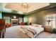 Spacious main bedroom with a fireplace, tray ceiling and large windows at 3619 Elinburg Ne Ct, Buford, GA 30519
