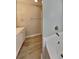 Main bathroom with white vanity, separate tub and stand-up shower at 4465 Kent Rd, Atlanta, GA 30337