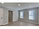 Spacious bedroom with recessed lighting, hardwood floors, and two windows for ample natural light at 4465 Kent Rd, Atlanta, GA 30337