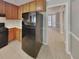 Spacious kitchen with stainless steel refrigerator, wood cabinets and views to a dining area at 4465 Kent Rd, Atlanta, GA 30337