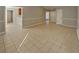 Inviting living room featuring neutral tile flooring, fresh paint, and natural light from a bright window at 4465 Kent Rd, Atlanta, GA 30337