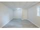 Finished basement with plank flooring, recessed lighting, and a window at 49 Sweetwater Ct, Powder Springs, GA 30127