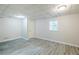 Finished basement featuring plank flooring, recessed lighting, and a window at 49 Sweetwater Ct, Powder Springs, GA 30127