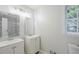 Clean bathroom featuring dual sinks, modern fixtures, and ample natural light for a refreshing and functional space at 49 Sweetwater Ct, Powder Springs, GA 30127