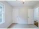 Bedroom with neutral walls, carpet flooring, a window, and a ceiling fan at 49 Sweetwater Ct, Powder Springs, GA 30127