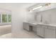 Elegant primary bathroom featuring double vanities, sleek countertops, and ample natural light at 778 Brooke View Drive, Canton, GA 30115