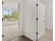 Carpeted bedroom with natural light and open doors at 778 Brooke View Drive, Canton, GA 30115