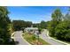 Inviting gated community entrance with lush landscaping and well-maintained roads at 778 Brooke View Drive, Canton, GA 30115