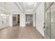 Elegant foyer with light hardwood flooring, neutral paint, coffered ceiling, and a view into the formal living area at 778 Brooke View Drive, Canton, GA 30115
