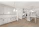 Large kitchen with white cabinets, stainless steel appliances, and a center island, perfect for entertaining at 778 Brooke View Drive, Canton, GA 30115