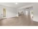 Open living area with hardwood floors, a kitchen, and a fireplace, all with natural light at 778 Brooke View Drive, Canton, GA 30115