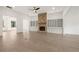 Open-concept living room with hardwood floors, a stone fireplace, built-in cabinets, and natural light at 778 Brooke View Drive, Canton, GA 30115