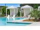 Relaxing poolside cabanas with lounge chairs overlook the sparkling community pool at 778 Brooke View Drive, Canton, GA 30115