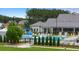 A beautiful community pool and clubhouse set amongst lush greenery at 778 Brooke View Drive, Canton, GA 30115