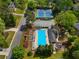 Aerial view of the community pool and tennis courts with lush green landscaping and surrounding residential area at 2830 Scottish Mill Way, Marietta, GA 30068
