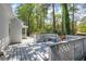 Inviting back deck with built-in seating, perfect for enjoying the serene wooded surroundings at 2830 Scottish Mill Way, Marietta, GA 30068