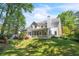 Beautiful backyard with a well-maintained lawn and mature trees, creating a private oasis at 2830 Scottish Mill Way, Marietta, GA 30068