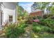 Charming backyard garden featuring a stone pathway and lush greenery at 2830 Scottish Mill Way, Marietta, GA 30068
