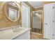 Bathroom vanity featuring stylish sink, faucet, shower with sliding glass door at 2830 Scottish Mill Way, Marietta, GA 30068