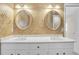 Bathroom with dual sinks, white cabinets, and round mirrors at 2830 Scottish Mill Way, Marietta, GA 30068