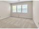 Bright bedroom featuring neutral carpet and a large window at 2830 Scottish Mill Way, Marietta, GA 30068