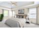 Serene bedroom featuring neutral paint, a ceiling fan, and natural light from the surrounding windows at 2830 Scottish Mill Way, Marietta, GA 30068