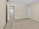 Carpeted bedroom featuring a door and windows with natural light at 2830 Scottish Mill Way, Marietta, GA 30068