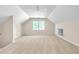 Large bonus room with neutral carpet, a window, and built-in storage at 2830 Scottish Mill Way, Marietta, GA 30068