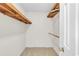 Walk-in closet with wooden shelving and ample storage space at 2830 Scottish Mill Way, Marietta, GA 30068