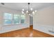 Bright dining room featuring hardwood floors, large windows, and a modern chandelier at 2830 Scottish Mill Way, Marietta, GA 30068