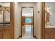 Hallway view of wet bar, library, and powder room at 2830 Scottish Mill Way, Marietta, GA 30068