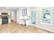 Bright eat-in kitchen boasts granite counters, tile floors, and access to an outdoor space at 2830 Scottish Mill Way, Marietta, GA 30068