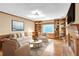 Inviting living room with a cozy fireplace, hardwood floors, built-in bookshelves and bright, natural light at 2830 Scottish Mill Way, Marietta, GA 30068