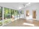 Sun room featuring tile floor, large windows offering scenic backyard views and access to a deck at 2830 Scottish Mill Way, Marietta, GA 30068