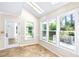 Light-filled sunroom boasts tile floors and lots of natural light from several windows and skylights at 2830 Scottish Mill Way, Marietta, GA 30068